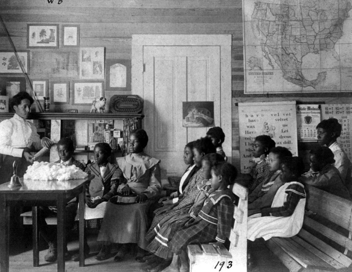 A teacher and her pupils, Annie Davis School, Alabama, 1902.